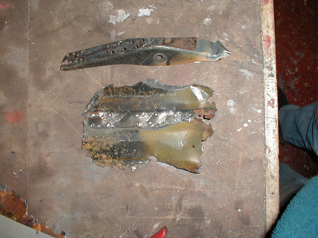 The rotted sections also have the engine lid hinges spot welded to them on the underside. So these had to come off too.